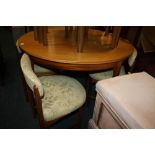 A VINTAGE TEAK EXTENDING DINING TABLE AND FOUR CHAIRS