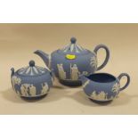 A WEDGWOOD BLUE JASPERWARE THREE PIECE TEA SERVICE