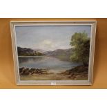 A FRAMED OIL ON BOARD OF A MOUNTAINOUS LAKE SCENE SIGNED R BAYFIELD