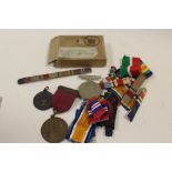 A COLLECTION OF MEDALS TO INCLUDE A ROYAL LIFE SAVING SOCIETY EXAMPLE, GOOD SAMARITAN MEDAL, RIBBONS