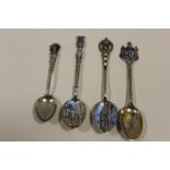 FOUR SILVER AND ENAMEL TEASPOONS