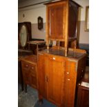 AN OAK TALLBOY, A BEDSIDE CABINET AND ANOTHER (3)