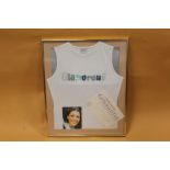 A FRAMED AND GLAZED VEST TOP WORN BY SUSANNE JONES FROM CORONATION STREET (KAREN MCDONALD) WITH