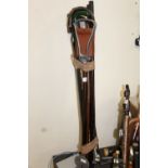 A COLLECTION OF GOLF CLUBS, WALKING STICKS, SHOOTING STICKS ETC.