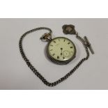 AN ANTIQUE SILVER CASED WALTHAM POCKET WATCH WITH SILVER ALBERT CHAIN AND FOB