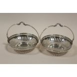 A PAIR OF WMF CIRCULAR SILVER PLATED BASKETS, with openwork and Greek key design border, basket