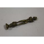 A VINTAGE BRASS PIPE TAMPER IN THE FORM OF NAPOLEON