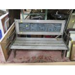 A SMALL CHILD SIZE WOODEN BENCH WITH CAST METAL ANIMAL PANEL TO BACK