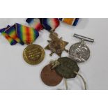 A GROUP OF THREE WWI MEDALS AWARDED TO 13172 PTE. S. SMITH. N. STAFFS. R. AND DOG TAGS