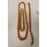 THREE VINTAGE AMBER STYLE BEAD NECKLACES
