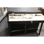 A WATCHMAKERS 9 DRAWER CHEST AND CONTENTS TO INCLUDE WRIST AND POCKET WATCH PARTS