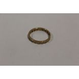 A 9 CARAT GOLD ETERNITY RING
