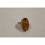 AN WHITE METAL AND AMBER DRESS RING