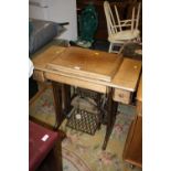 A VINTAGE OAK SINGER TREADLE SEWING MACHINE