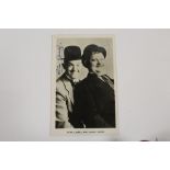 A SIGNED BLACK AND WHITE PHOTOGRAPH OF STAN LAUREL AND OLIVER HARDY (LAUREL & HARDY)