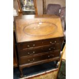 A VINTAGE MAHOGANY BUREAU