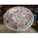 A LARGE ORIENTAL FAMILLE ROSE CERAMIC CHARGER