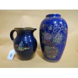 A VINTAGE CROWN DEVON CREAM JUG, blue ground with gilded decoration of an Oriental garden, H 14