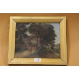 A SMALL GILT FRAMED OIL ON CANVAS DEPICTING A RURAL SCENE WITH COTTAGE AND HORSE AND CART