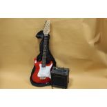A RED ROCKET MUSIC ELECTRIC GUITAR WITH CARRY BAG AND BURSWOOD G10 AMPLIFIER