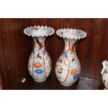 A PAIR OF ORIENTAL BALUSTER VASES WITH FRILLED RIMS, each vase decorated with a figure in a shaped