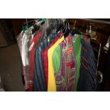 A RAIL OF LADIES AND GENTS VINTAGE AND MODERN CLOTHING