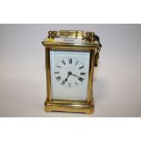 AN ANTIQUE FRENCH BRASS 8 DAY STRIKING MOVEMENT CARRIAGE CLOCK