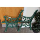 TWO CAST PAINTED GREEN BENCH ENDS