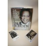 A SIGNED PHOTOGRAPH OF PAUL ROBESON, TOGETHER WITH ANOTHER AND HIS PICTORIAL BIOGRAPHY (3)