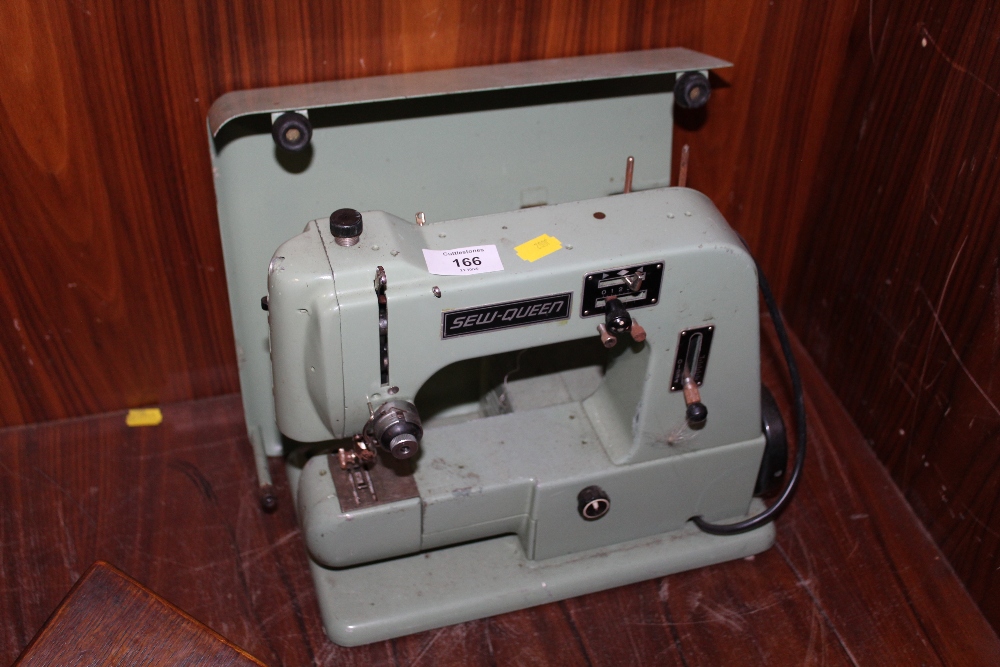 A VINTAGE SEW-QUEEN SEWING MACHINE