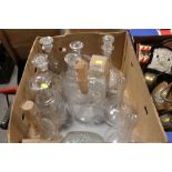 A BOX OF GLASS DECANTERS ETC.