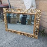 A LARGE ORNATE 19TH CENTURY ITALIAN FLORENTINE CARVED WOOD FRAME WITH FITTED MIRROR