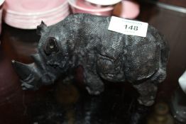 A CARVED WOODEN BLACK FOREST STYLE FIGURE OF A RHINO