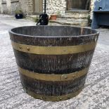 A LARGE 19TH CENTURY BRASS BOUND OAK BUCKET / PLANTER