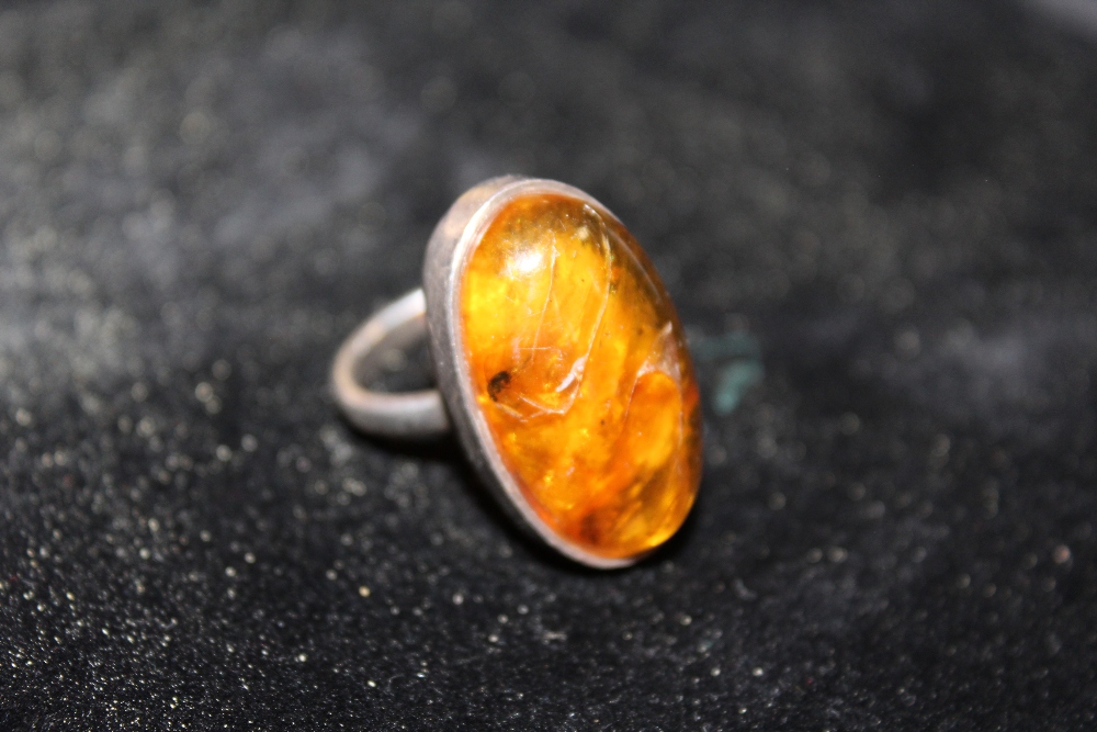 AN WHITE METAL AND AMBER DRESS RING