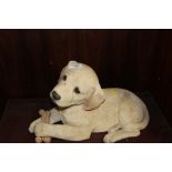 A SANDICAST FIRESIDE TYPE FIGURE OF A GOLDEN LABRADOR PUPPY