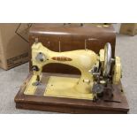 A CASED VINTAGE BSM SEWING MACHINE