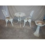 AN ALUMINIUM TWO CHAIR PATIO SET AND A CONCRETE BIRDBATH