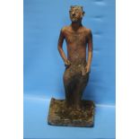 AN ANTIQUE TERRACOTTA FIGURE OF PAN SET INTO LATER CONCRETE BASE