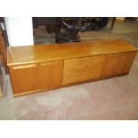 A VINTAGE TEAK LOW SIDEBOARD