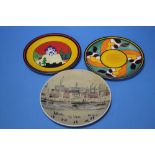 THREE PLATES TO INCLUDE CLARICE CLIFF WEDGWOOD 'BLUE LUZERNE' IN 'THE BIZARRE WORLD OF CLARICE