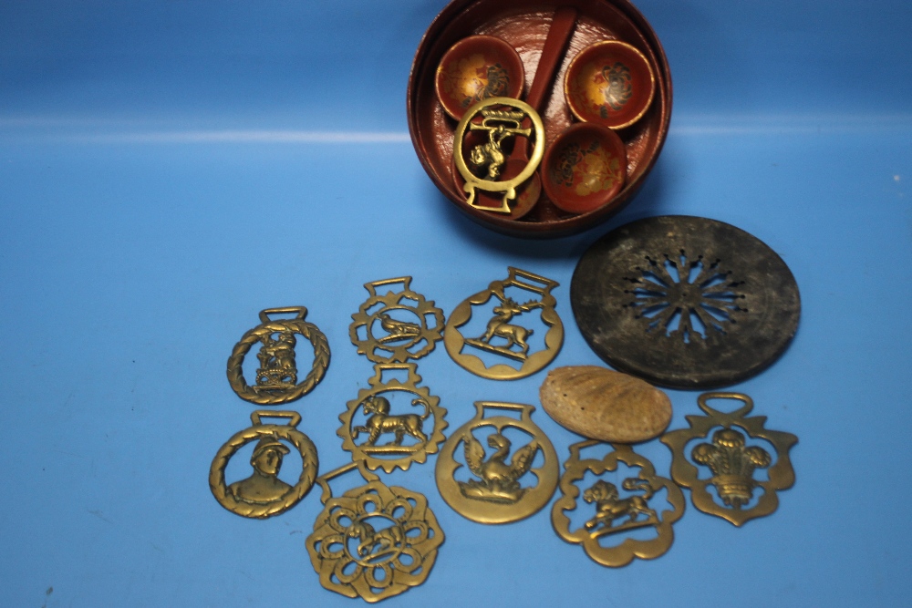 A PAPIER MACHE ORIENTAL SET TOGETHER WITH A CLOCK BACK, HORSE BRASSES ETC.