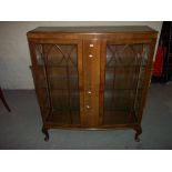 A BOWED CHINA CABINET