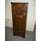 AN ANTIQUE HEAVILY CARVED HALL WARDROBE
