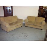 A FABRIC TWO PIECE SUITE COMPRISING TWO TWO SEATER SOFAS