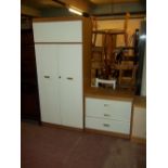 A TWO PIECE MODERN BEDROOM SUITE COMPRISING A WARDROBE AND THREE DRAWER CHEST