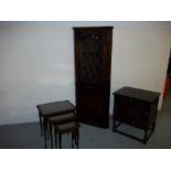A GOTHIC STYLE OAK CORNER UNIT, A NEST OF TABLES AND A PRIORY CUPBOARD