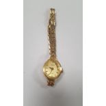 A LADIES 9 CT GOLD AVIA WATCH WITH INTEGRAL STRAP