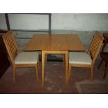 A SMALL SQUARE KITCHEN TABLE AND TWO CHAIRS