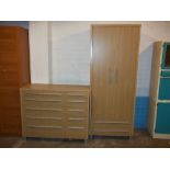 A MODERN TWO PIECE BEDROOM SUITE COMPRISING A TEN DRAWER CHEST AND TWO DOOR WARDROBE